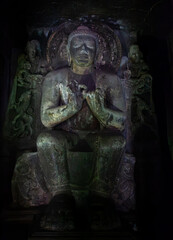 Meditating Buddha in Shadowed Cave