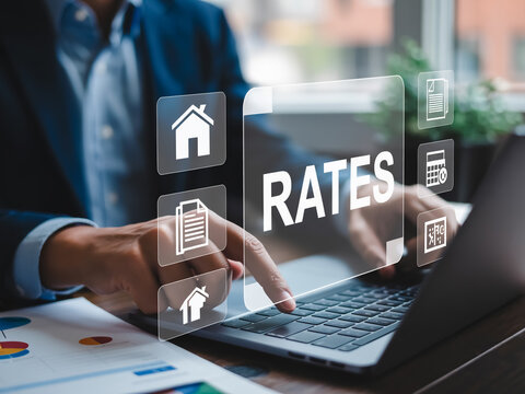 Corporate hands typing on laptop with floating tax icons and 'RATES' panel in a sleek office setting.