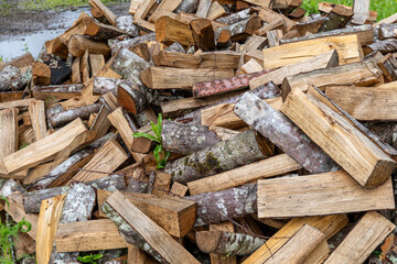 Stack of Split Firewood Logs – Rustic Close-Up of Freshly Cut Wood for Heating and Winter Fuel Storage in Countryside Setting
