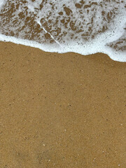 Beach wave close up from top view