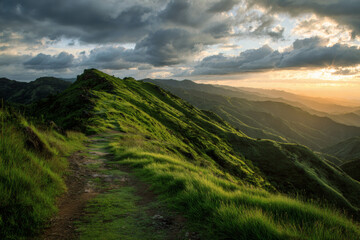 Dramatic sunset over lush green mountain ridge with winding path