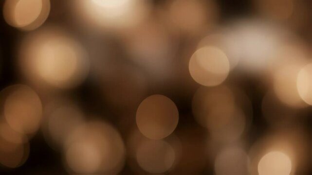 Vibrant bokeh lights in bruin coffee hues create a festive background, ideal for holiday themes, enhancing the atmosphere of joy and celebration during Christmas and New Year festivities