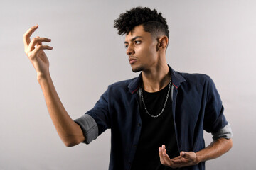 model young slim man in denim shirt in kung fu pose