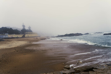Foggy morning on a beach in Portugal, nostalgic atmosphere
