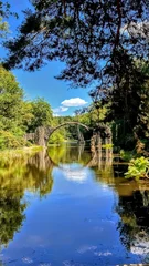 Fototapete Rakotzbrücke Devil’s Bridge in Rhododendron Park Kromlau, Germany, magical reflection  © Yunona