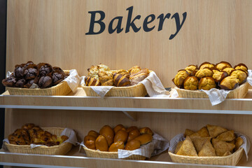 Delicious baked goods displayed in a bakery setting with warm lighting