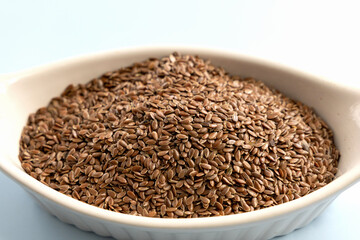 Healthy uncooked raw flax seeds in a bowl. High quality photo
