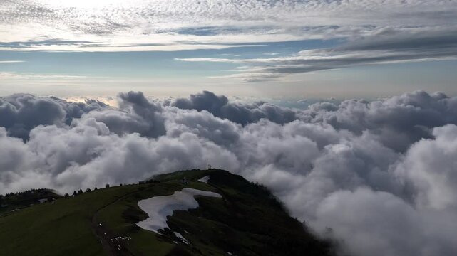 Gomismta Mountain Village Below Snowy Peaks and Rolling Clouds &ndash; Aerial Drone Panorama
