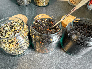 Assortment of flower herbal and tea in glass jars. High quality photo