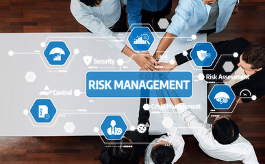 A top-down view of diverse team members collaborating on risk management strategies with digital icons representing security and assessment in a modern workspace. Amity