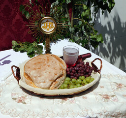 offerings of bread and wine to the saint