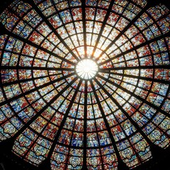 Stained glass window dome with colorful patterns and radial symmetry