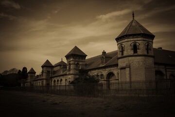 Old brick building under sepia sky