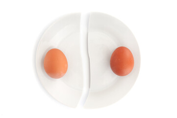 Two eggs on broken plate isolated  on a white background