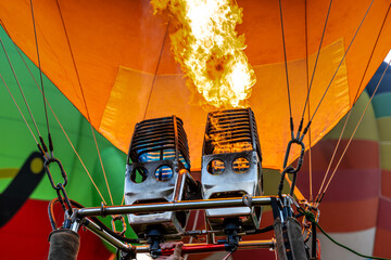 Close up propane and frame burner in hot air balloon ready to launch in the sky