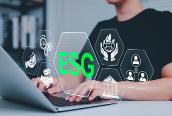 ESG Environmental Social Governance Investment Concept. Laptop with green ESG text representing environmental, social, and governance for responsible investment and sustainable business practices.