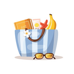 Beach bag filled with vibrant summer accessories is set against the backdrop of a white background. Travel