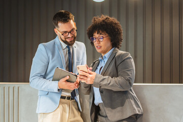 diverse businesswoman and businessman discuss at the company reception