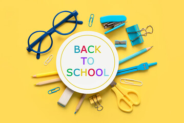 Top view of school supplies and round blank with the text Back to School. Back to school concept