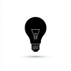 Obraz premium A light bulb is shown in black and white. The light bulb is a symbol of illumination and knowledge