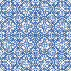 Seamless pattern of blue watercolor painted ornaments on a white backdrop