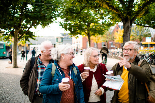 Senior friends exploring a town together on vacation