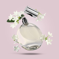 Bottle of floral perfume and jasmine flowers in air on lilac background