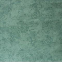 Obraz premium Green plaster texture with subtle mottled patterns and smooth stucco effect, ideal for backgrounds, interior design mockups, wall textures, posters, and graphic design projects.