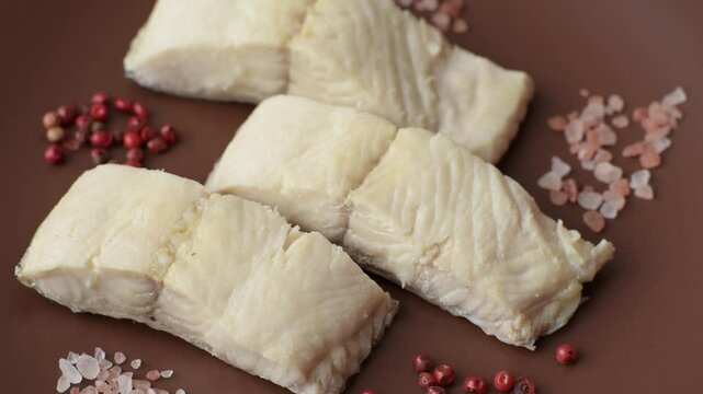 White fish fillets, seafood cooked with salt and spices. Fish fillets on a ceramic plate