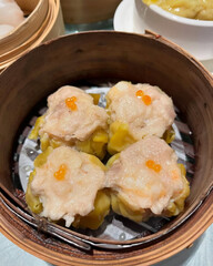 Steamed siu mai topped with orange roe.