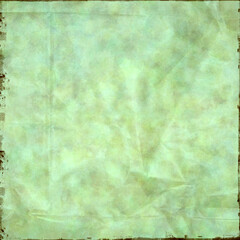 Obraz premium Vintage green crumpled paper texture with soft marbled tones, worn distressed edges, and subtle folds, ideal for scrapbooking, invitations, overlays, posters, and rustic creative projects.