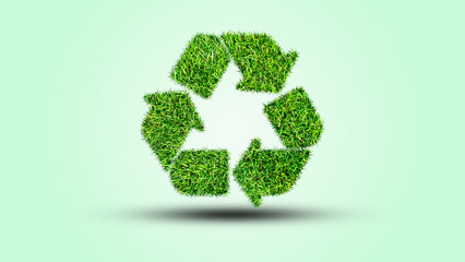 Recycle logo symbol from the green grass, isolated on white
