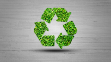 Recycle logo symbol from the green grass, isolated on white