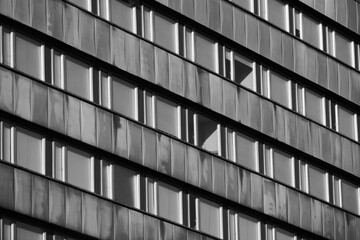 gray front of an old residential appartment building in a tristesse