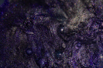 Glittery violet texture with shiny waves
