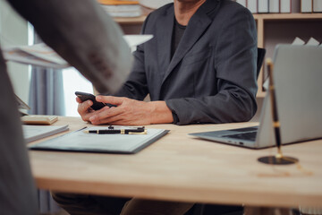 Businessmen consult with lawyers, submit additional documents, and pay for lawyers' services. After...