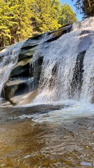 Mumlava Waterfall in Czechia, powerful cascade in forested mountains