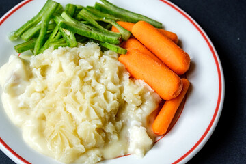 Traditional Tasty Baked Fish Pie With Carrots And Runnner Beans