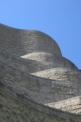 Section of curvy stone building  