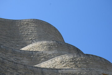 Section of curvy stone building  