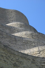 Section of curvy stone building  