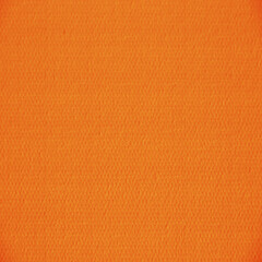 Fototapeta premium Bright orange fabric texture with subtle woven grain and soft uniform pattern. Ideal for textile mockups, fashion design, upholstery, crafts, packaging, and digital backgrounds.