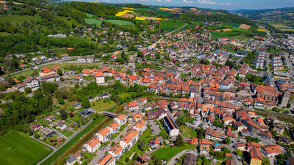 Panoramic aerial of the old town of the city Moudon in Switzerland on a sunny noon in summer
