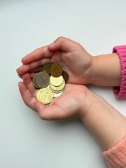 coins in the Childs hands