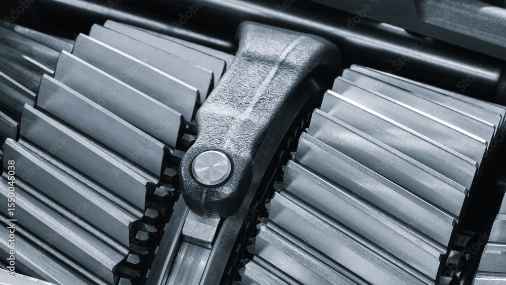 Poster Close up of a gear, gears are all different sizes and shapes, and they are all lined up next to each other. Concept of precision complexity blue tone