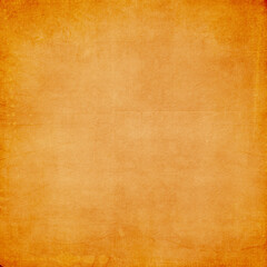 Warm orange vintage textured background with faded center and grunge edges. Ideal for autumn themes, invitations, posters, scrapbooking, packaging, and digital art projects.