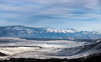 The view looking east from the summit of Mammoth Mountain to snow covered landscape.