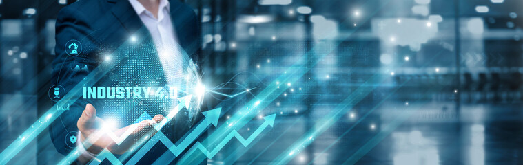 Businessman holding industry 4.0 icon and intelligent automation global network, cyber-physical systems, smart manufacturing, digital transformation, data-driven analytics, advanced robotics