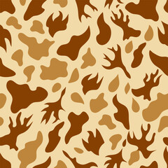 Seamless pattern with animal print in warm beige tones. Creamy colored deer skin design background with irregular textured spots for textiles, wallpapers, wrapping paper, fabric.