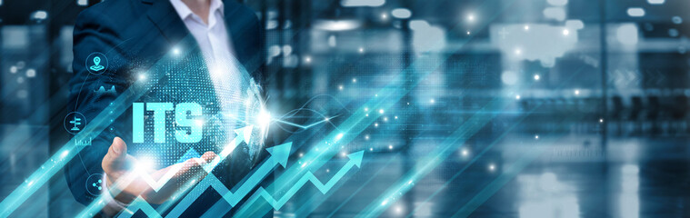 Businessman holding ITS and integrated mobility global network, real-time navigation, automated infrastructure, predictive analytics, vehicle-to-everything communication, traffic optimization.